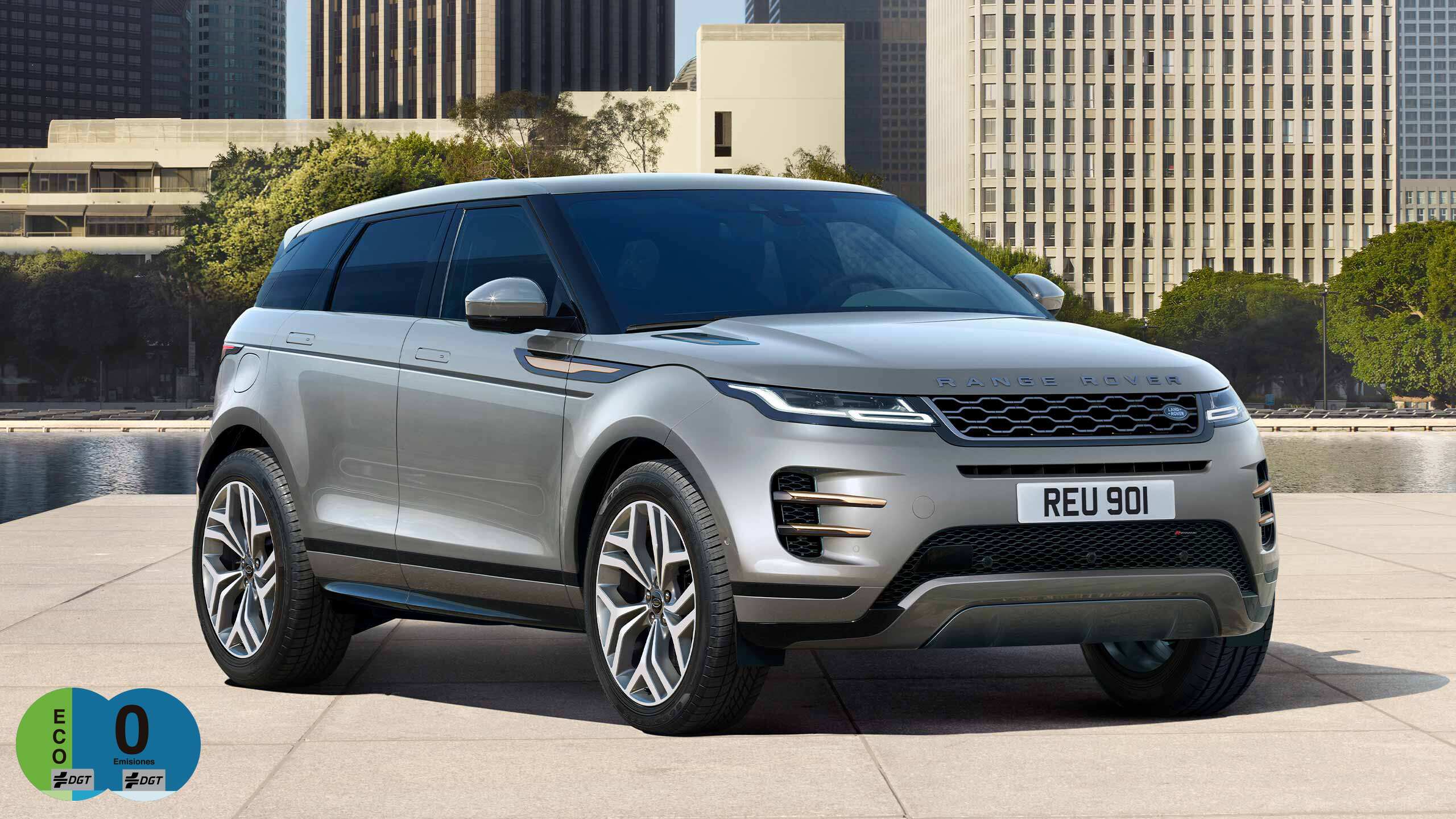 Evoque Parked By Garden Area Against Buildings In City