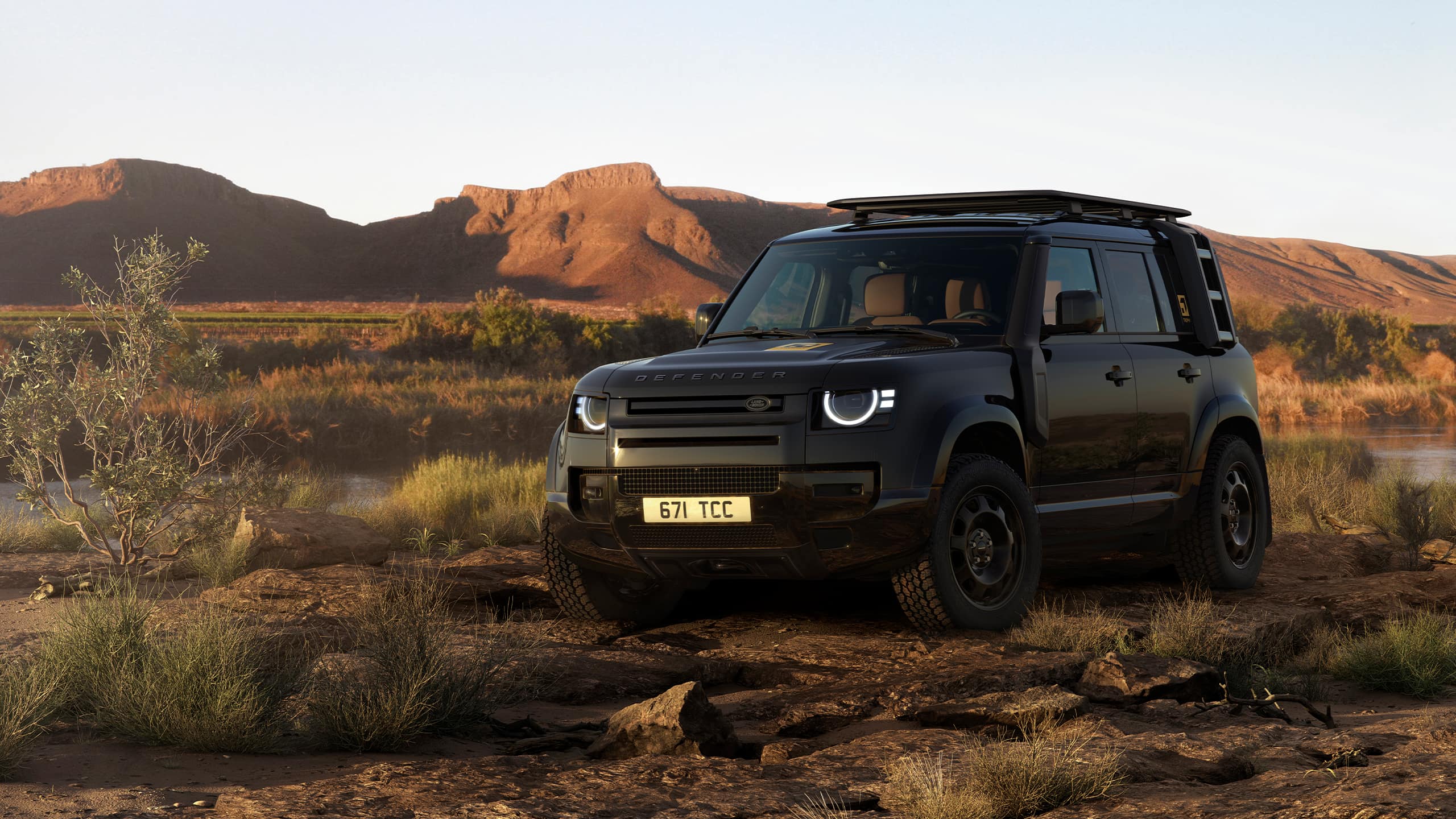 Defender parked on hill road